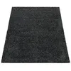 A dark gray shaggy rug is shown from a slightly elevated angle against a white background. Produktbild-Vorschau