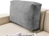 A grey cushion placed on a beige sofa. Produktbild-Vorschau