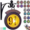 A collage of a Harry Potter themed Platform 9 3/4 illuminated sign and multiple smaller versions of the sign in different colors, along with a remote control. Produktbild-Vorschau