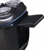 A close-up view of a black electric shaver, showing the rotary heads and a pop-up trimmer extended. Produktbild-Vorschau