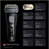 A black electric shaver with various feature callouts and warranty information on a black background. Náhľad obrázku produktu