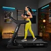 A woman is running on a treadmill in a home gym setting. Produktbild-Vorschau