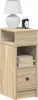 A bedside table with a lamp and an alarm clock on top. Voir les images du produit