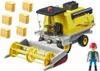 A toy combine harvester with hay bales and a toy farmer. Anteprima dell’immagine prodotto
