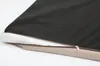 A close-up view of a dog bed with a partially unzipped cover, revealing the inner padding. Anteprima dell’immagine prodotto