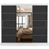A sliding door wardrobe with a mirrored section reflecting a bedroom interior. Produktbild-Vorschau