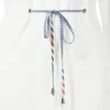 A close-up of a white bathrobe's drawstring. Produktbild-Vorschau