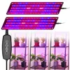 Two LED grow light panels are shown above three small plant stands, each with two potted plants. Anteprima dell’immagine prodotto