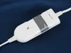 A white and gray electric blanket controller with cords attached, lying on a dark blue fabric surface. Náhled obrázku produktu