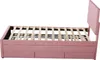 A pink upholstered bed frame with a wooden slatted base and three drawers underneath, shown from the side against a white background. Podgląd zdjęcia produktu