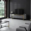 A modern living room with a TV stand, coffee table, and armchair. Anteprima dell’immagine prodotto
