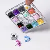 A hand is holding a clear acrylic switch tester filled with various colored mechanical keyboard switches. Several switches are also shown scattered on the white surface below. Produktbild-Vorschau