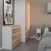 A bedroom scene with a dresser, wardrobe, and bed. Náhled obrázku produktu