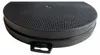 A close-up, slightly angled shot of a round, black charcoal filter with a grid pattern on top and a small black handle attached to the side. Produktbild-Vorschau