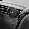 A close-up shot of a car's air vent with a BMW M Edition wireless car charger attached. Podgląd zdjęcia produktu