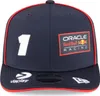 A close-up studio shot of a navy blue baseball cap with red trim and multiple logos and text. Anteprima dell’immagine prodotto