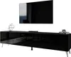 A modern black high-gloss TV stand with chrome legs, featuring a large flat-screen TV mounted above it. Decorative items are placed on the stand. Náhľad obrázku produktu