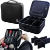 A collage of images showing a black makeup organizer case, its interior with dividers, and a person's hands organizing makeup brushes and items. Náhľad obrázku produktu