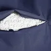 A close-up view of a navy blue fabric with an open zipper revealing white filling. Produktbild-Vorschau