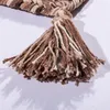 A close-up of a woven rug tassel with brown and beige threads. Produktbild-Vorschau