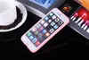 A pink iPhone case is placed on a table next to a cup of coffee and a magazine. Produktbild-Vorschau
