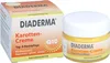 A product box and jar of Diaderma Karotten Creme Q10 are displayed side-by-side against a white background. Produktbild-Vorschau