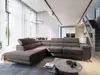 A modern living room with a large sectional sofa, coffee table, and stairs leading to an upper level. Produktbild-Vorschau