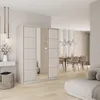 A modern bedroom or dressing area with a large sliding door wardrobe, a vanity, and a dining area in the background. Produktbild-Vorschau