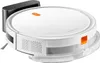 A white Xiaomi robot vacuum cleaner with orange accents and a black charging dock is shown against a white background. Voir les images du produit
