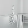 A close-up of a piece of ice or water dripping, possibly from a freezer or refrigerator. Produktbild-Vorschau