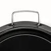 A close-up view of a black pan with a silver handle. Anteprima dell’immagine prodotto