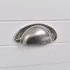 Close-up of a silver drawer pull on a white drawer. Podgląd zdjęcia produktu