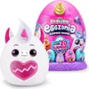 A plush toy unicorn and a large pink egg-shaped surprise toy packaging are displayed. Náhled obrázku produktu