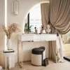 A modern vanity table with a LED mirror, makeup brushes, and decorative items, set in a well-lit room with elegant curtains. Náhľad obrázku produktu