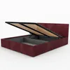 A bed frame with the mattress support lifted to reveal the storage compartment. Produktbild-Vorschau