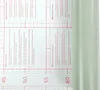 A close-up of a roll of self-adhesive film with printed instructions and grid lines. Produktbild-Vorschau