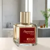 A perfume bottle is displayed on a surface with a blurred bathroom background. Anteprima dell’immagine prodotto