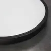 A close-up view of the edge of a round LED ceiling light with a black rim and a white diffuser. Náhľad obrázku produktu