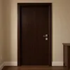 A closed dark brown wooden door with a silver handle and a part of a wooden cabinet on the right side, against a cream-colored wall and white baseboard. The floor is dark wood. Produktbild-Vorschau