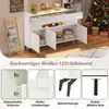 A white LED sideboard with various compartments and drawers, displayed in a room with a Christmas tree and decorative items. The image also includes close-up shots highlighting product features. Voir les images du produit