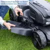 A person is shown attaching a part to a lawnmower. Produktbild-Vorschau