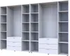 An empty, white, four-door wardrobe with shelves and drawers. Náhled obrázku produktu