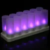 A set of 12 LED tea lights on a charging base, glowing purple. Náhled obrázku produktu