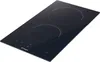 A black induction hob with two cooking zones, shown from a slightly elevated angle on a white background. Voir les images du produit