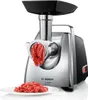 A Bosch meat grinder is shown in operation, grinding meat, with a pile of ground meat on a plate in front of it. Náhled obrázku produktu