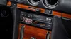 Close-up of a vintage car's dashboard, focusing on the car stereo system. Voir les images du produit