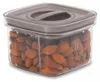 A clear, studio shot of a clear plastic food storage container filled with almonds. Produktbild-Vorschau