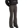 A person wearing ski pants and ski boots. Produktbild-Vorschau
