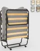 A folded bed with a mattress and a grey and white patterned blanket on a white background. Produktbild-Vorschau
