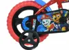 A close-up view of the rear wheel and chain guard of a Paw Patrol themed children's bicycle. Produktbild-Vorschau